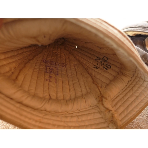 490 - AN INSULATED FLYING HELMET AND AN INSULATED CAP DATED 1948