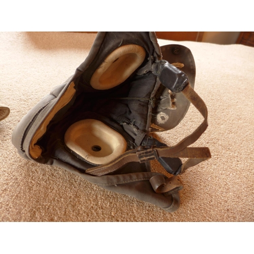 490 - AN INSULATED FLYING HELMET AND AN INSULATED CAP DATED 1948