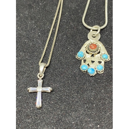 546 - SIX SILVER NECKLACES WITH VARIOUS PENDANTS TO INCLUDE CROSSES