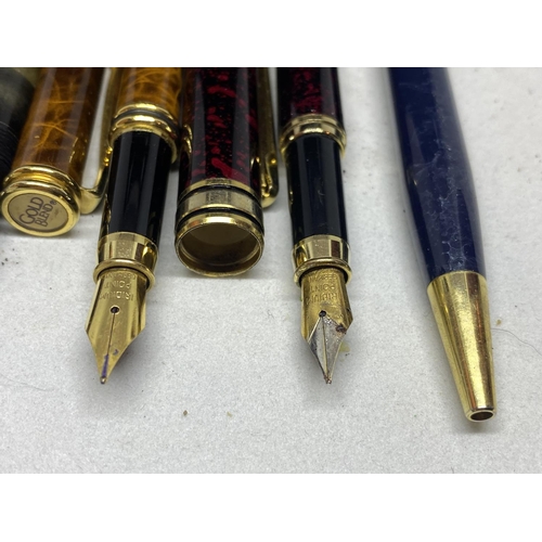 574 - FIVE VARIOUS PENS TO INCLUDE FOUR FOUNTAIN PENS AND A BIRO