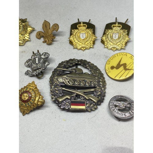 577 - A COLLECTION OF VARIOUS BADGES