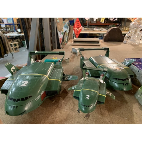 884 - THREE MODEL THUNDERBIRDS AND ACCOMPANYING BATTERY OPERATED STAGING