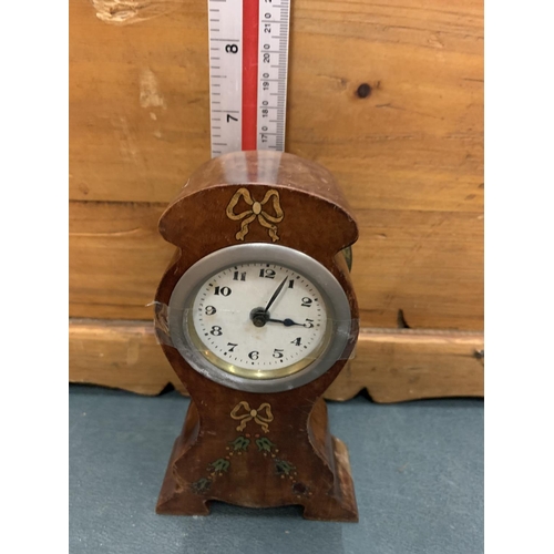 103 - A WOODEN INLAID MANTEL CLOCK