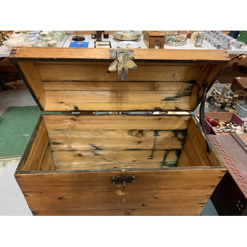 105 - A LARGE WOODEN CHEST WITH METAL HINGE, CLASP AND HANDLES