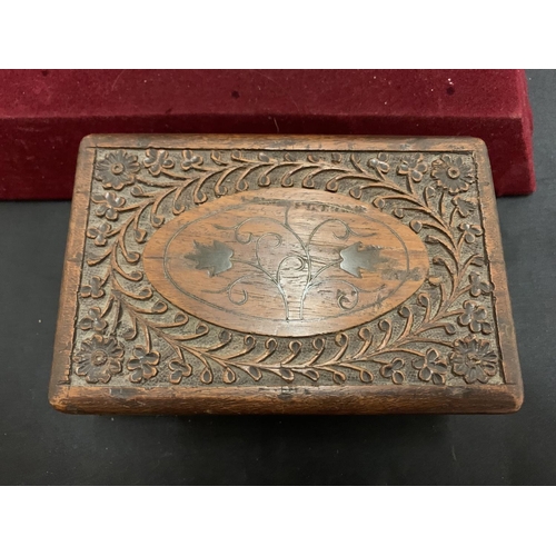 11 - A HEAVILY CARVED WOODEN BOX AND A FURTHER HINGED BOX