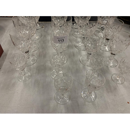 113 - AN ASSORTMENT OF CUT GLASSES TO INCLUDE SIX BOXED CHAMPAGNE FLUTES ETC