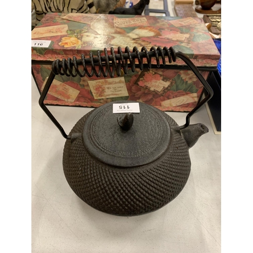 115 - A CAST IRON FIRESIDE KETTLE