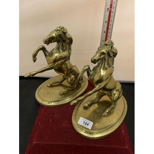 124 - A PAIR OF BRASS REARING HORSES ON PLINTHS