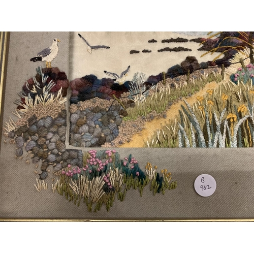 130 - A FRAMED TAPESTRY OF A COASTAL SCENE