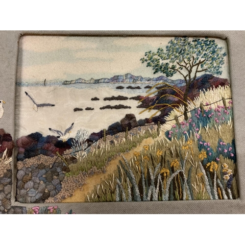 130 - A FRAMED TAPESTRY OF A COASTAL SCENE