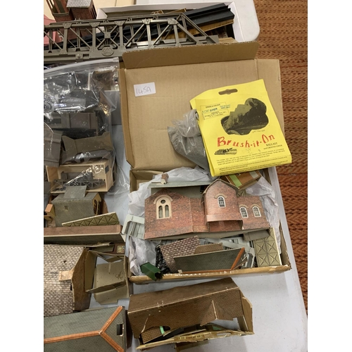 145A - A COLLECTION OF CARDBOARD AND PLASTIC MODEL TRAIN SET BUILDINGS AND BRIDGES ETC