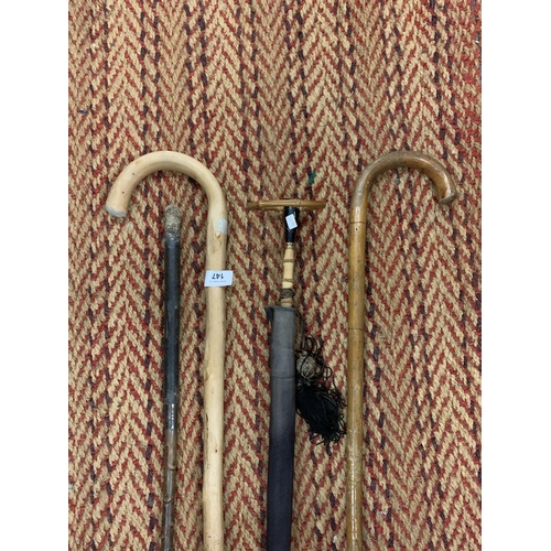 147 - THREE WOODEN WALKING STICKS AND A VINTAGE UMBRELLA WITH BAMBOO HANDLE