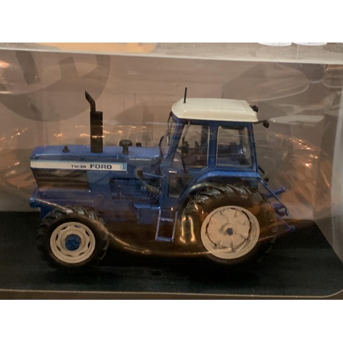 160 - A BOXED UNIVERSAL HOBBIES DIE CAST FORD TRACTOR 1:32