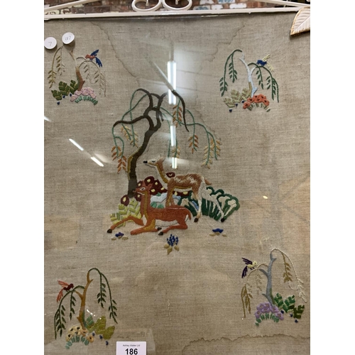 186 - AN ORNATE VINTAGE FIRESCREEN DEPICTING VARIOUS ANIMALS