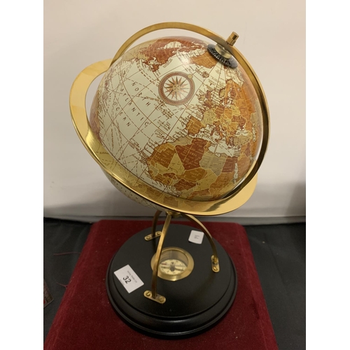 32 - A GLOBE ON A WOODEN STAND TO INCLUDE A COMPASS WITHIN THE BASE HEIGHT 31CM