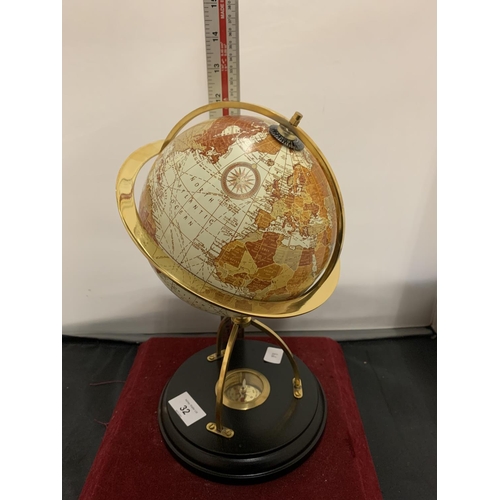 32 - A GLOBE ON A WOODEN STAND TO INCLUDE A COMPASS WITHIN THE BASE HEIGHT 31CM