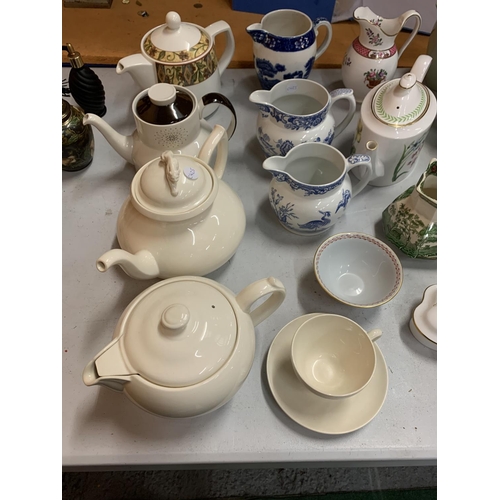 33 - A LARGE ASSORTMENT OF COPELAND SPODE TEAPOTS AND JUGS TO INCLUDE ROYAL DOULTON EXAMPLES