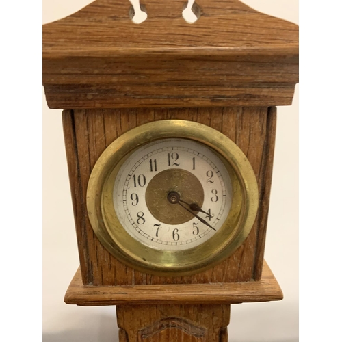 51 - A WOODEN MODEL OF A MINIATURE GRANDFATHER CLOCK