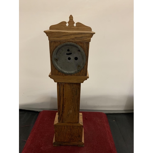 51 - A WOODEN MODEL OF A MINIATURE GRANDFATHER CLOCK