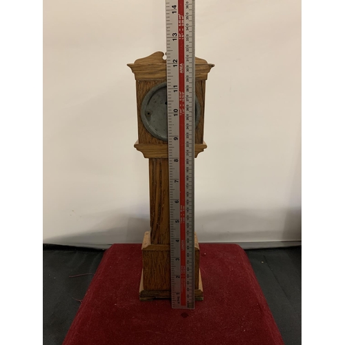 51 - A WOODEN MODEL OF A MINIATURE GRANDFATHER CLOCK