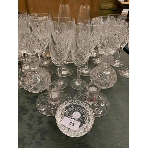 65 - A LARGE QUANTITY OF GLASS WARE TO INCLUDE TWELVE WINE GLASSES AND BOWLS ETC