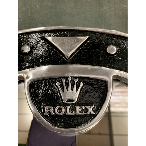 67A - A CAST 'ROLEX' WALL MIRROR