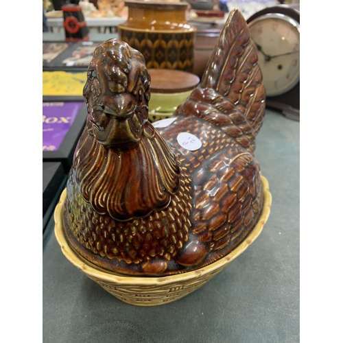 70 - A 'BESWICK' HEN NEST EGG HOLDER AND TWO 'HORNSEA' STORAGE JARS