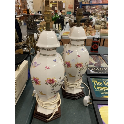 75 - A PAIR OF DECORATIVE CERAMIC TABLE LAMPS WITH A FLORAL DESIGN