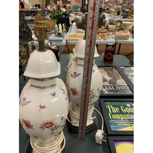 75 - A PAIR OF DECORATIVE CERAMIC TABLE LAMPS WITH A FLORAL DESIGN