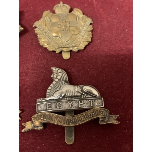 587 - FOUR LINCOLNSHIRE CAP BADGES