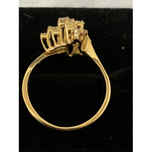 588 - A DECORATIVE ABSTRACT DESIGN 18 CARAT GOLD DIAMOND CLUSTER RING 3.47G APPROXIMATELY 60 PTS SIZE: O