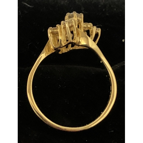 588 - A DECORATIVE ABSTRACT DESIGN 18 CARAT GOLD DIAMOND CLUSTER RING 3.47G APPROXIMATELY 60 PTS SIZE: O