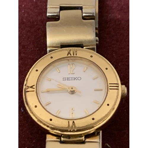 594 - A SEIKO LADIES YELLOW METAL WRIST WATCH IN WORKING ORDER