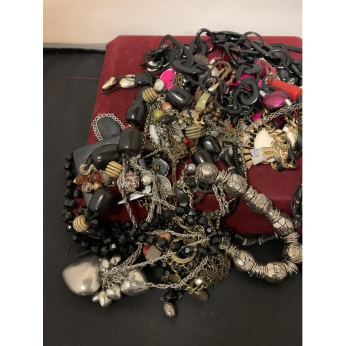 595 - A LARGE QUANTITY OF COSTUME JEWELLERY