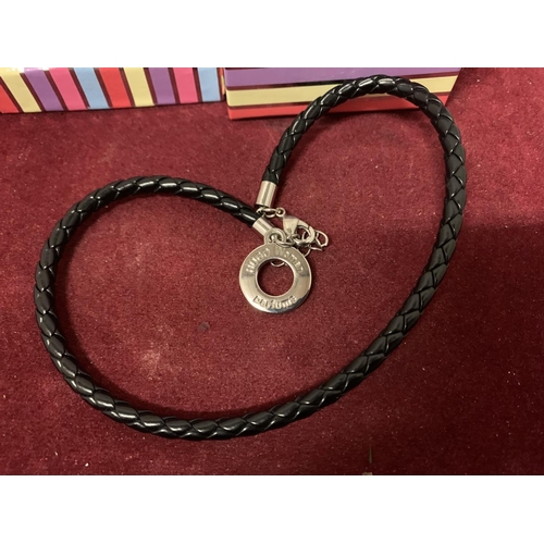 601 - A HUGO BOSS PERFUME LEATHER NECKLACE WITH WHITE METAL PENDANT