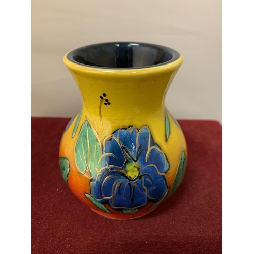 704 - AN ANITA HARRIS HAND PAINTED AND SIGNED BLUE FLOWERS VASE