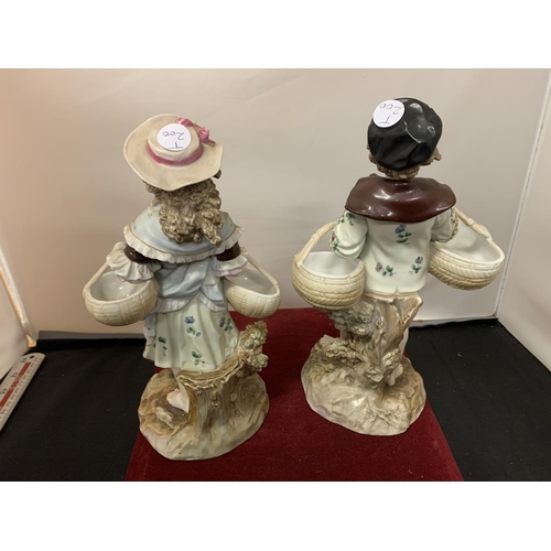 729 - TWO FIGURINES OF A BOY AND GIRL