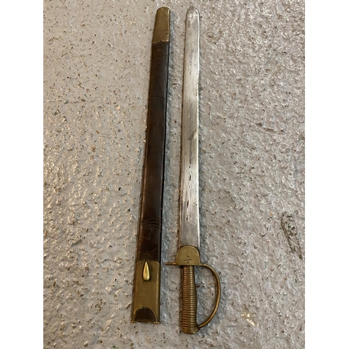 495 - AN SWORD BAYONET AND LEATHER SCABBARD WHICH WOULD FIT A BAKER RIFLE