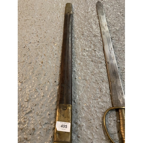 495 - AN SWORD BAYONET AND LEATHER SCABBARD WHICH WOULD FIT A BAKER RIFLE