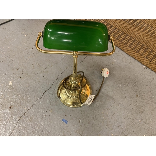 632 - A BRASS BANKERS LAMP WITH ANGLED GREEN GLASS SHADE