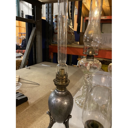 652 - A PAIR OF GLASS BARLEY TWIST STYLE OL LAMPS, A DECORATIVE PEWTER OIL LAMP AND TANKARD ETC