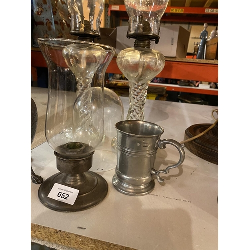 652 - A PAIR OF GLASS BARLEY TWIST STYLE OL LAMPS, A DECORATIVE PEWTER OIL LAMP AND TANKARD ETC