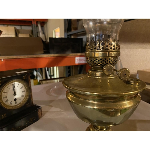 657 - A BRASS OIL LAMP WITH GLASS FUNNEL (HEIGHT APPROXIMATELY 55 CM)