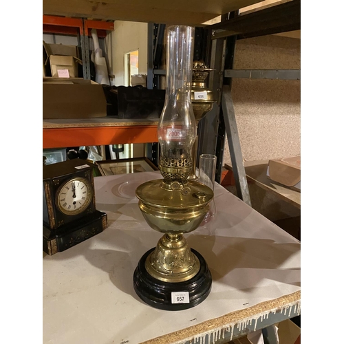 657 - A BRASS OIL LAMP WITH GLASS FUNNEL (HEIGHT APPROXIMATELY 55 CM)