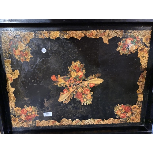 658 - A LARGE BLACK LAQUERED BUTLER'S TRAY WITH FLORAL DECORATION ON A FOLD OUT STAND ( 50 CM X 69 CM)