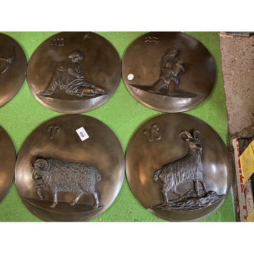 659 - TWELVE CIRCULAR RESIN WALL PLAQUES DEPICTING THE SIGNS OF THE ZODIAC (ONE A/F)