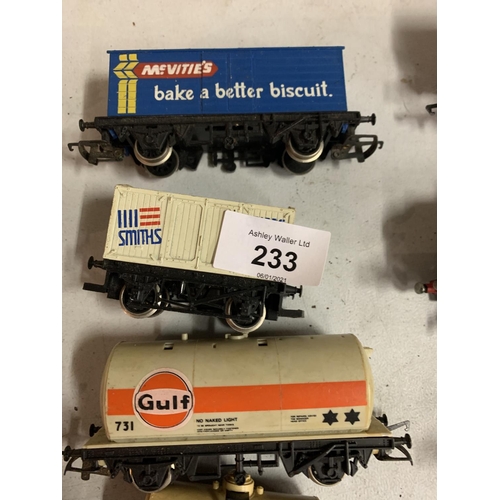 233 - SEVEN OO GAUGE FREIGHT CARRIAGES TO INCLUDE A GULF FUEL TANKER AND A MCVITIES CONTAINER ETC