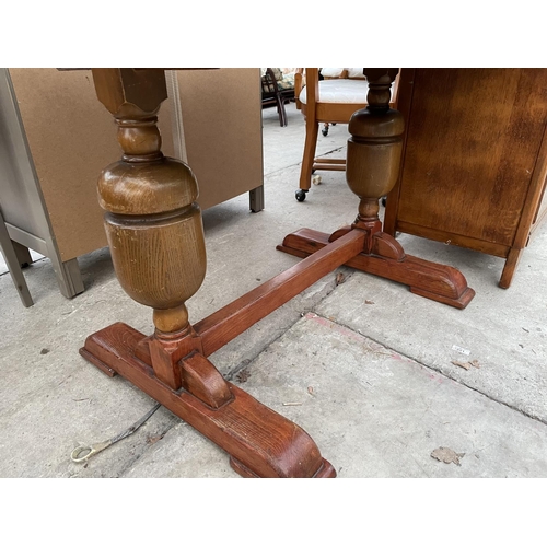 2343 - AN OAK DRAW LEAF TABLE