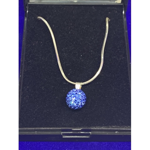 513 - A SILVER CHAIN MARKED 925 WITH A BLUE CRYSTAL BALL PENDANT IN A PRESENTATION BOX