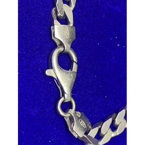 517 - A HEAVY SILVER BRACELET WITH FLAT CURB LINK DESIGN MARKED 925 IN A PRESENTATION BOX